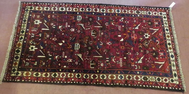 North West Persian Malayer rug, central panel of red ground with flower and bird design, beige