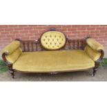 A Victorian walnut show-wood sofa, with carved cornice, reeded spindles and acanthus carved and