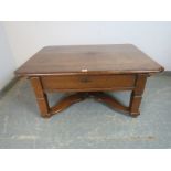 An 18th century and later French oak coffee table with rounded corners, the top sliding to reveal