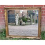A 19th century style rectangular wall mirror in moulded gilt gesso frame. H78cm W88cm D5cm (approx).