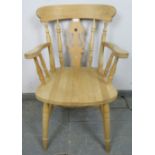 A single beech carver farmhouse kitchen chair with shaped and pierced backsplat and turned spindles,