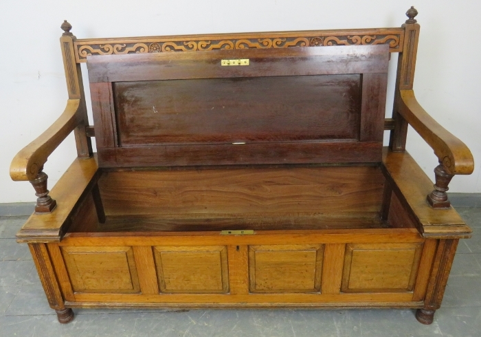 An Arts & Crafts walnut settle by James Shoolbred, with turned ball finials, carved frieze and - Image 3 of 4