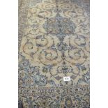 A good Persian Kashan carpet, pale blue ground central motif with scrolls. 354cm x 245cm.