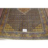 A good Persian Tabriz rug, with central motif on a patterned field, pastel blue-yellow-cream.