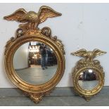 Two similar vintage Regency style convex wall mirrors with eagle cornices by Syroco, USA. Largest