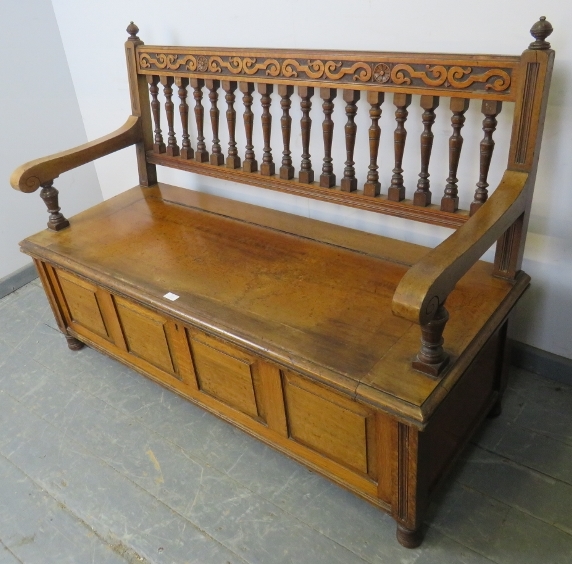 An Arts & Crafts walnut settle by James Shoolbred, with turned ball finials, carved frieze and - Image 4 of 4