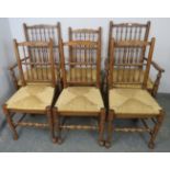 A set of six (4+2) oak Lancashire spindle-back dining chairs with rush seats, on tapering supports