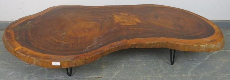 A naturalistic hardwood low coffee table, on hairpin legs. H24cm W147cm D68cm (approx). Condition