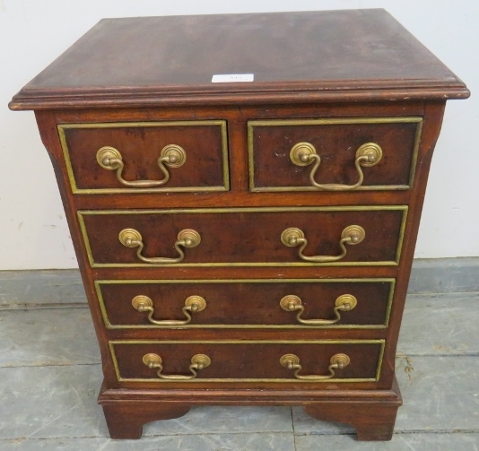 A vintage walnut apprentice style chest of two short over three long cock-beaded drawers with