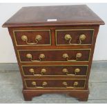 A vintage walnut apprentice style chest of two short over three long cock-beaded drawers with
