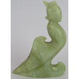 A Chinese carved pale celadon Jade mythical figure/hook, Ming style but likely Qing, 13cm high.