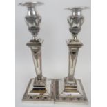 A pair of good quality silver plated Adams revival candlesticks, 19th century. With weighted