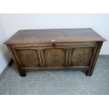 An early 18th century panelled oak coffer, with diamond carved front, on stile supports. H66cm