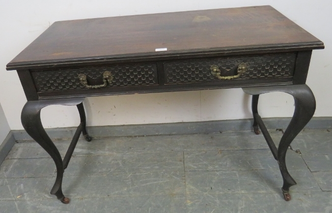 An Edwardian mahogany console table, housing two short drawers with blind fretwork detail and