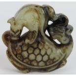 A Chinese carved pale celadon and black Jade model depicting a bat on a turtle, Ming style but