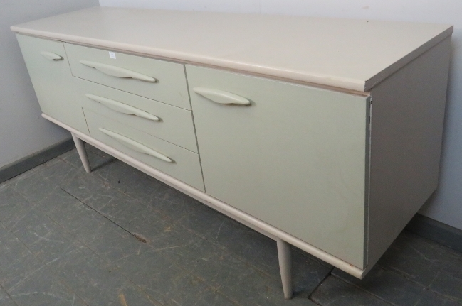 A mid-century teak sideboard, housing three short drawers flanked by cupboards with loose shelves, - Image 2 of 2