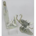 A Lladro/Nao porcelain group of 2 Ostriches running, 24cm high, a Lladro praying female figure, 35cm