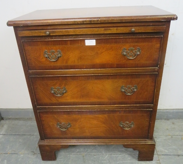 A reproduction mahogany bachelor’s chest, crossbanded and strung with satinwood and ebony, with