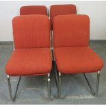 A set of four mid-century chairs, upholstered in burnt orange striped material, on tubular chrome