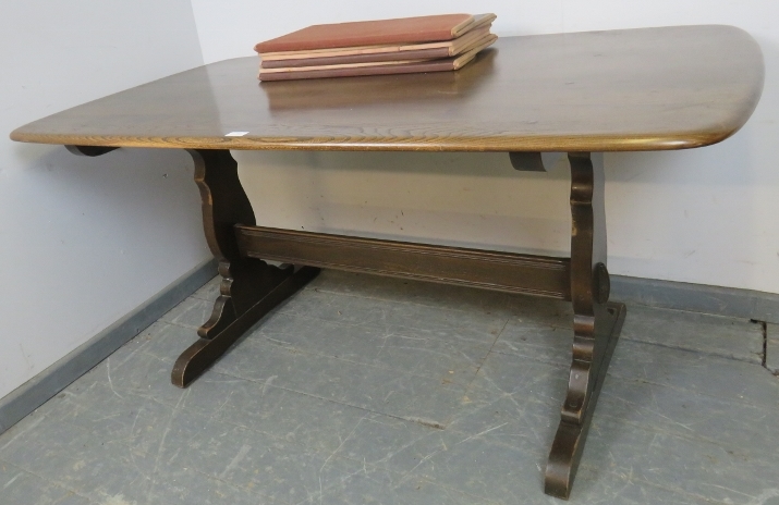 A mid-century elm refectory dining table by Ercol, on shaped supports with a middle stretcher. H72cm - Image 4 of 5