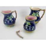 Set of three Majolica Blackberry pattern jugs in graduated sizes. Largest 8" height, smallest 6 1/4"