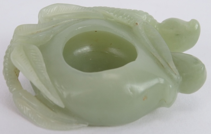 A Chinese carved celadon Jade brush washer, of leaf and stem form, Ming style but likely Qing, 7cm