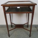 An Edwardian mahogany bijouterie table strung with satinwood, on tapering square supports united