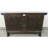 A small vintage oak coffer in a 17th century taste, with diamond carved front, on bracket feet.