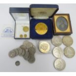 A collection of British commemorative coins and American coins. Also included is a Victorian