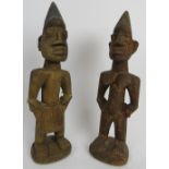 Tribal Art: A pair of West African carved wood Ibeji Twins, Yoruba Tribe. Carved as a male and