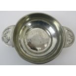 Archibald Knox ‘Tudric’ for Liberty twin handled white metal Quaich, circa 1905. Of circular form,