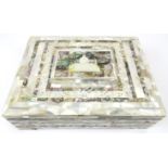 A mother of pearl and abalone shell jewellery box, early 20th century. Of rectangular form with a