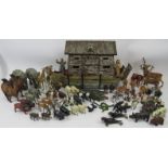 A hand crafted Noah’s Ark and collection of model animals. The models are mostly cold painted