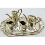 A five piece silver miniature tea service, comprising of teapot, hot water jug, sugar bowl, milk jug