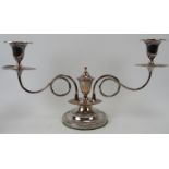 An electroplated silver two branch candelabra, 19th century. With tendril stems. Detachable