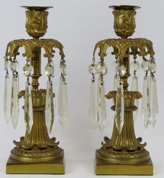 A pair of French Empire style ormolu and crystal glass lustres, 19th century. Both with nine cut