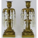 A pair of French Empire style ormolu and crystal glass lustres, 19th century. Both with nine cut