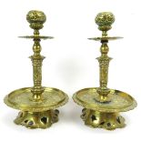 A pair of Victorian brass candlesticks, 19th/early 20th century. Of a typical overall Dutch form