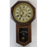 American Ansonia drop dial wall clock, 19th century. The movement strikes on a gong. Key and