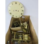 A box of clock parts for spares and repairs