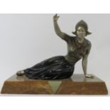 A French Art Deco polychrome decorated spelter figure of a Dutch female. Mounted on a marble and