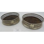 A pair of Georgian silver coasters with pierced decoration, indistinct London hallmarks, possibly