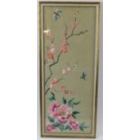 A Chinese silk panel, 20th century. Framed and glazed. 57.5 cm x 21.5 cm Condition: Some minor