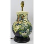 A Moorcroft Lamia pattern table lamp. Of bulbous form with tubeline decoration. 13.8 in (35 cm)