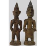 Tribal Art: A pair of West African carved wood Ibeji Twins, Yoruba Tribe. Carved as a male and