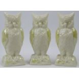 A group of three Belleek porcelain owl spill vases. Each with a pearlescent cream and yellow
