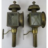 A pair of brass carriage oil lamps, late 19th/early 20th century. Both with glass panels. (2 items).