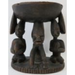 Tribal Art: A Kola nut carved wood offering stand, Yoruba Tribe. Carved depicting three figures