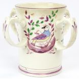 A rare Victorian lustreware four handled tankard, late 19th century. The cylindrical body