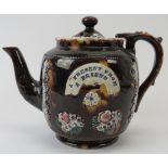 A Victorian bargeware teapot, 19th century. 7.3 in (18.5 cm) height. Condition report: Good